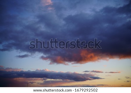                  
Beautiful dramatic clouds at sunset.              
