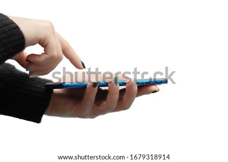 Female hands hold a smartphone on a white background