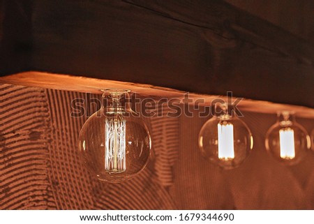 Closeup of edison lamp, Loft timber light with edison lamps