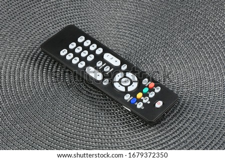 Tv remote control on textured background. High resolution photo. Full depth of field.