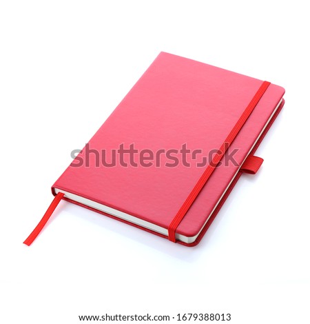 Lush lava red colour leather fabric hardcover notebook with elastic band lay back on white surface. Top view with notebook closed. Isolated on white background. For mockup, branding & advertising.