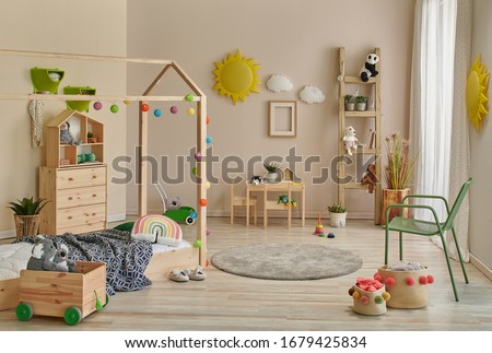 Young decoration room, wooden Montessori and cabinet, carpet table and chair concept.