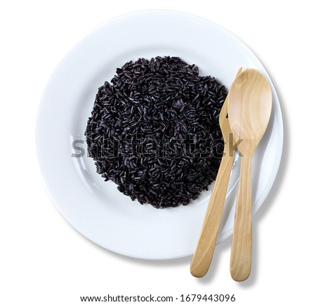 Rice berry or black rice in a white ceramic dish, Agriculture crops in Asia. isolated on white background. with clipping paths.