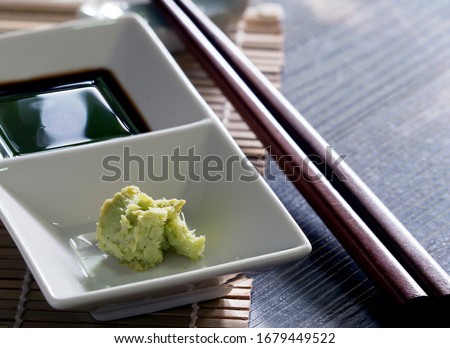Ingredients for dipping, eaten with salmon, sashimi and shushi, popular Japanese food. Soy sauce called shoyu and wasabi. Enhances the taste of raw fish to be more delicious. Don't eat wasabi too much