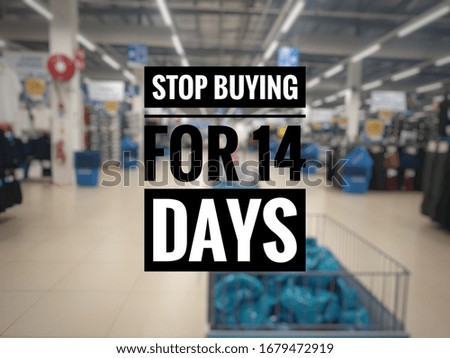 STOP BUYING FOR 14 DAYS word with blur background picture.