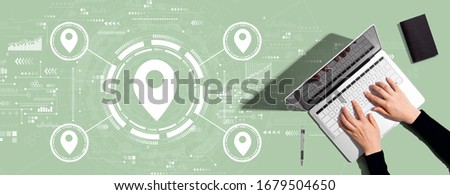 Map pin concept with person using a laptop computer