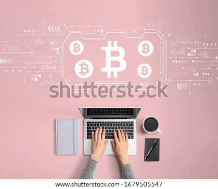 Bitcoin theme with person using a laptop