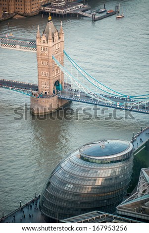 Aerial view of Tower Bridge and City Hall area. London colors at dusk.