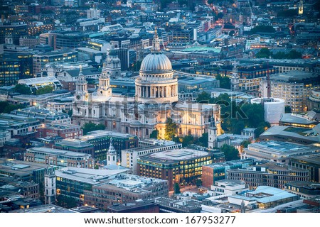 London. Stunning aerial view of St. Paul Cathedral and city skyline at dusk.