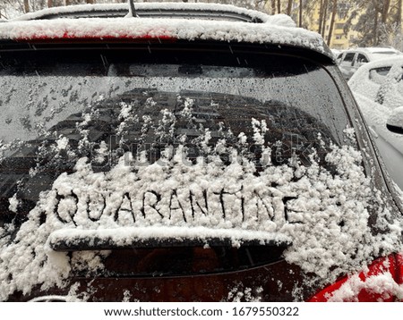 quarantine. Inscription text on a car that stands in the snow in the parking lot. Transport during the pandemic.