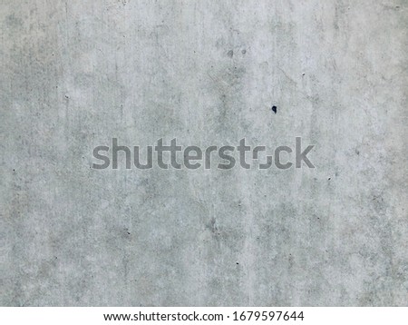 Old pale raw concrete wall grunge with cracked line background vintage loft style.Cement construction wall texture background.