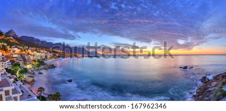 Cape Town's beaches in summer with Table Mountain & Twelve Apostles in the background Royalty-Free Stock Photo #167962346