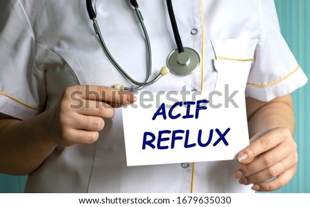 concept words ACIF REFLUX in the hands of a doctor
