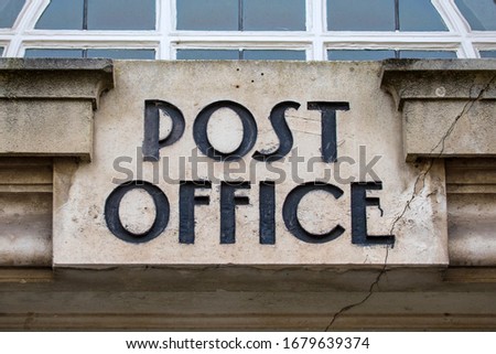 Close-up of a vintage Post Office sign in the town of Taunton in Somerset, UK.