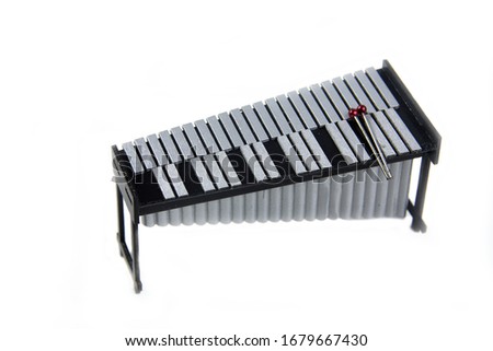 vibraphone and drumsticks isolated on white background flat lay. Image contains copy space Royalty-Free Stock Photo #1679667430