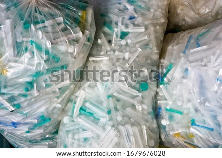 few clean plastic packages with used syringes at coronavirus time, covid19 panic Royalty-Free Stock Photo #1679676028