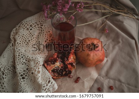 Pomegranate and pomegranate juice. Pomegranate still life