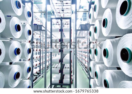 factory production of synthetic thread Royalty-Free Stock Photo #1679765338