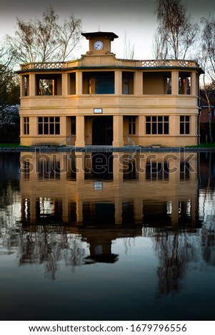 A reflective picture of a building in the morning light