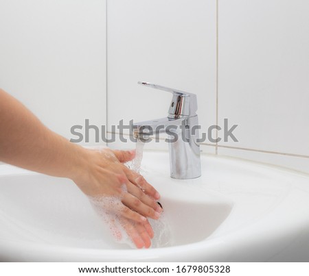 A person washing his hands