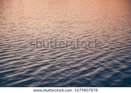 picture of the surface water in the sunset time.