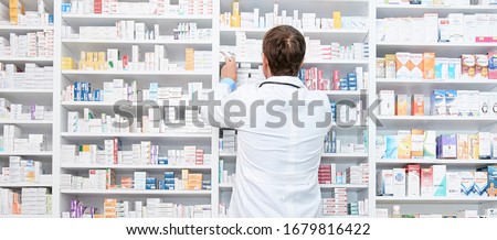 Pharmacist working in a drugstore Royalty-Free Stock Photo #1679816422