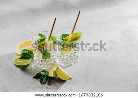 Homemade lemonade. Summer drinks with fresh citrus and ice. 