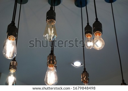 Lighting design of hanging light bulbs in a cafe or restaurant. 