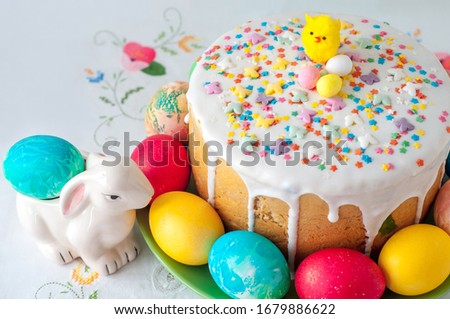 Rabbit figurine near the decorated Easter cake