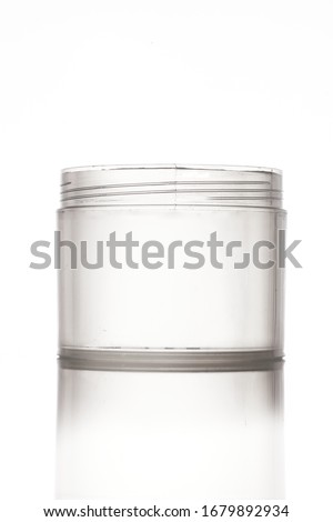 Open canister transparent white background open lid lidless plastic  Royalty-Free Stock Photo #1679892934