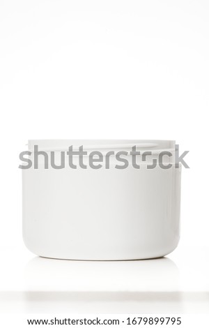Open cream canister transparent white background closed plastic jar cup transparent lid beauty product mockup no label ready to design cosmetic Royalty-Free Stock Photo #1679899795