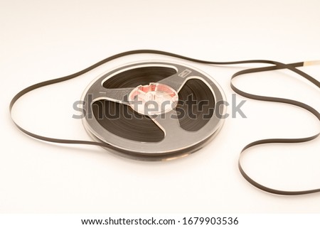 old tape for stereo recording on white background Royalty-Free Stock Photo #1679903536