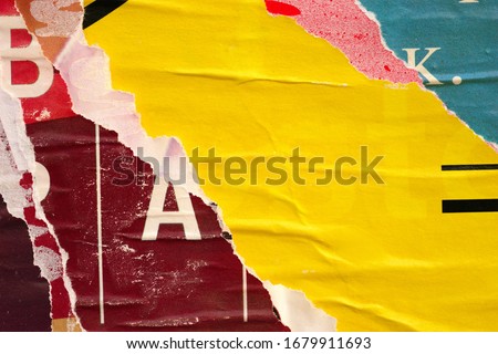 Old ripped torn posters grunge texture background creased crumpled paper backdrop placard surface / Urban street posters 