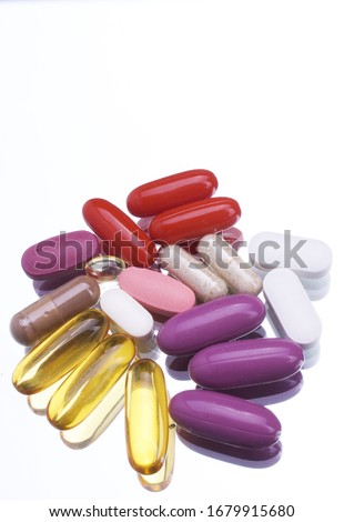 Various Nutritional Supplements on White Background