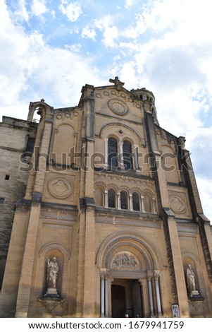Perspective of the neo-Romanesque facade of the Uzès Cathedral (Cathédrale Saint-Théodorit d'Uzès), Occitanie, France. It was built in the 19th century
