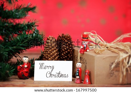 Christmas ornaments in a organic environment, with white card.