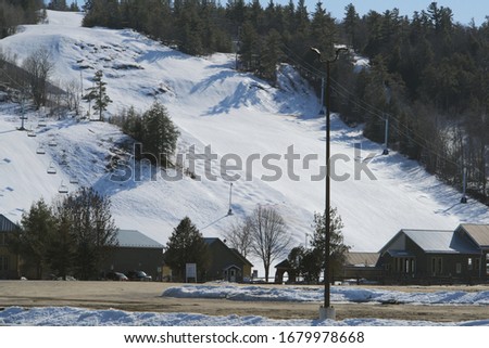 An empty ski hill on a sunny day