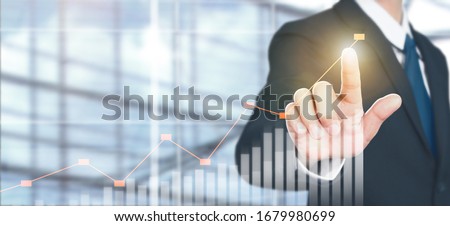 Businessman plan graph growth and increase of chart positive indicators in his business Royalty-Free Stock Photo #1679980699