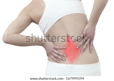 Acute pain in a woman back. Female from behind holding hand to spot of back pain. Concept photo with Color Enhanced .