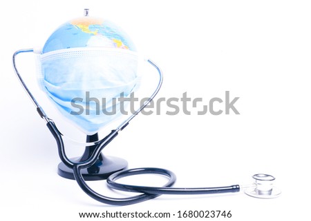 A picture of globe wearing mask with stethoscope insight. World are combating the worse epidemic call covid-19.