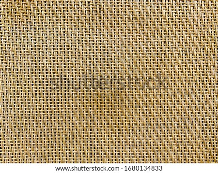 Natural Wood weave speaker grill cloth from the vintage electric guitar amp cabinet with copy space. Background or texture.