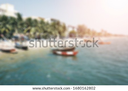 Blur background at beach with sunny light.