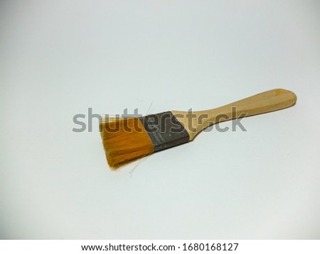 Paint brush isolated against a white background.