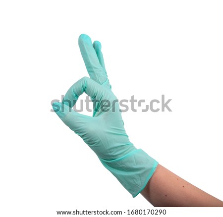 Green rubber glove on hand isolated on the white