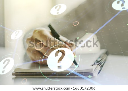 Double exposure of question mark hologram and man hand writing in notebook on background. Sociology and psychology concept