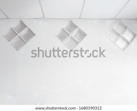 3 glass windows in the house. light glass windows, background of glass window and white cement wall. Space for text