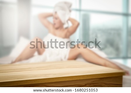 Table background of free space and slim young woman with window. 
