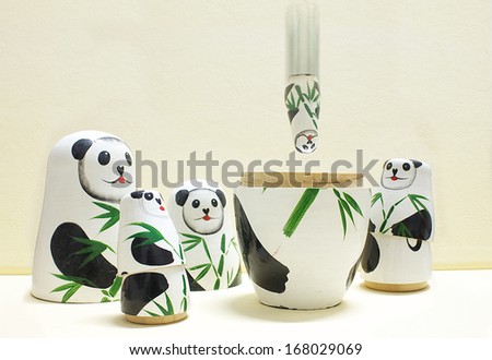 Panda toys  with warm background 