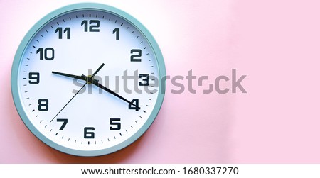 Analog white clock on a pink background. Clock in close up. Place for text. Business, are you ready. Royalty-Free Stock Photo #1680337270