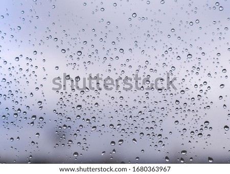 
High resolution water drops on window glass